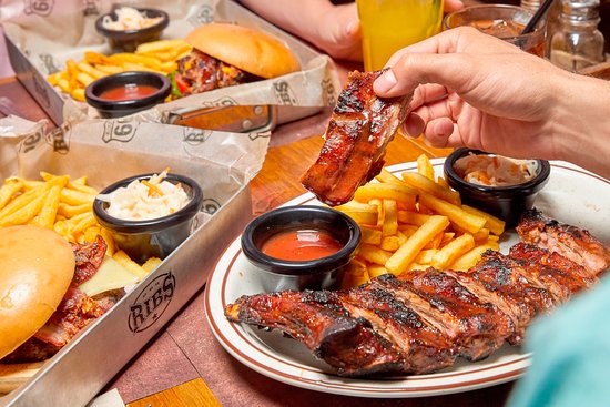 Ribs - Abada: Sabores auténticos de True American Barbecue en el corazón de Madrid, donde cada bocado es una fiesta de tradición y calidad. 1 costillas
