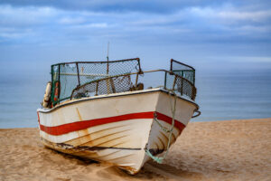 old rusty fishing boat beach sand with seascape view